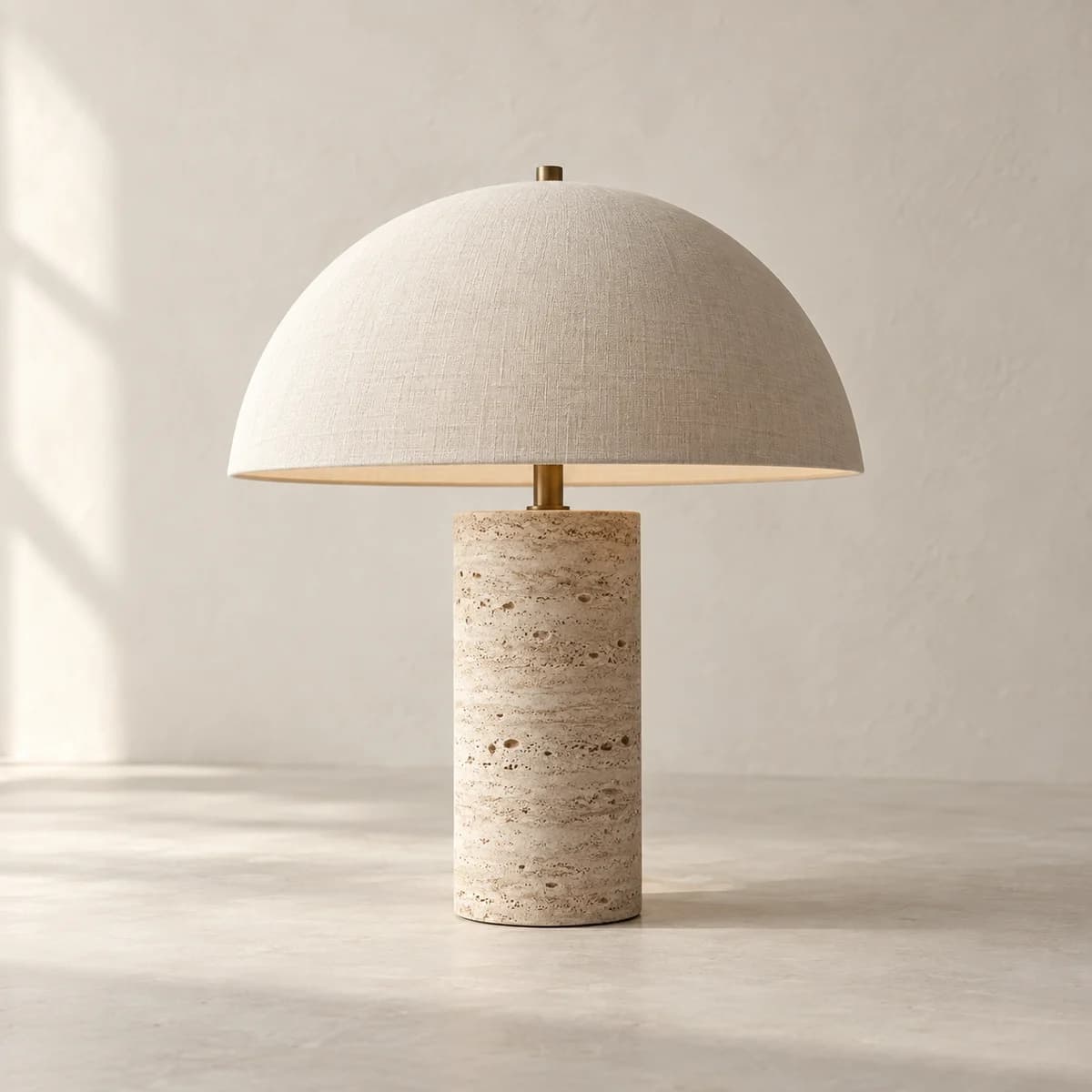 Halo Table Lamp, honed travertine furniture in a warm plaster studio; AI-generated product concept
